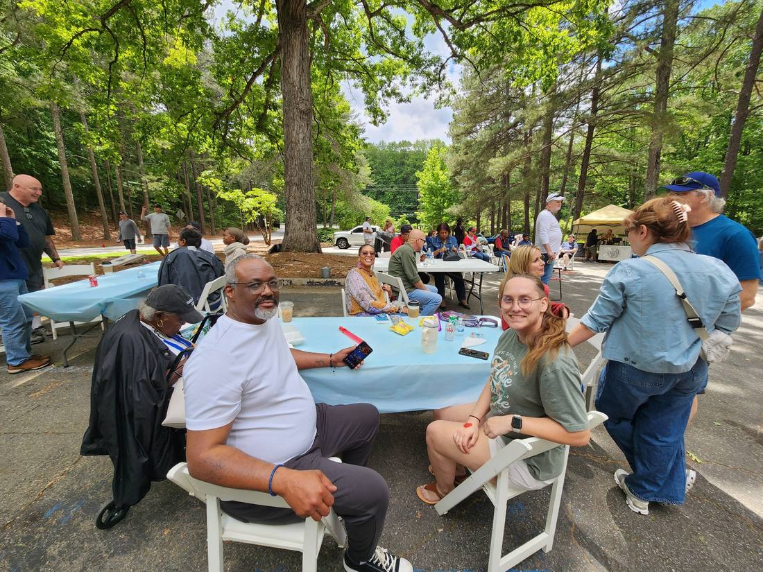 Friends talking at a picnic table