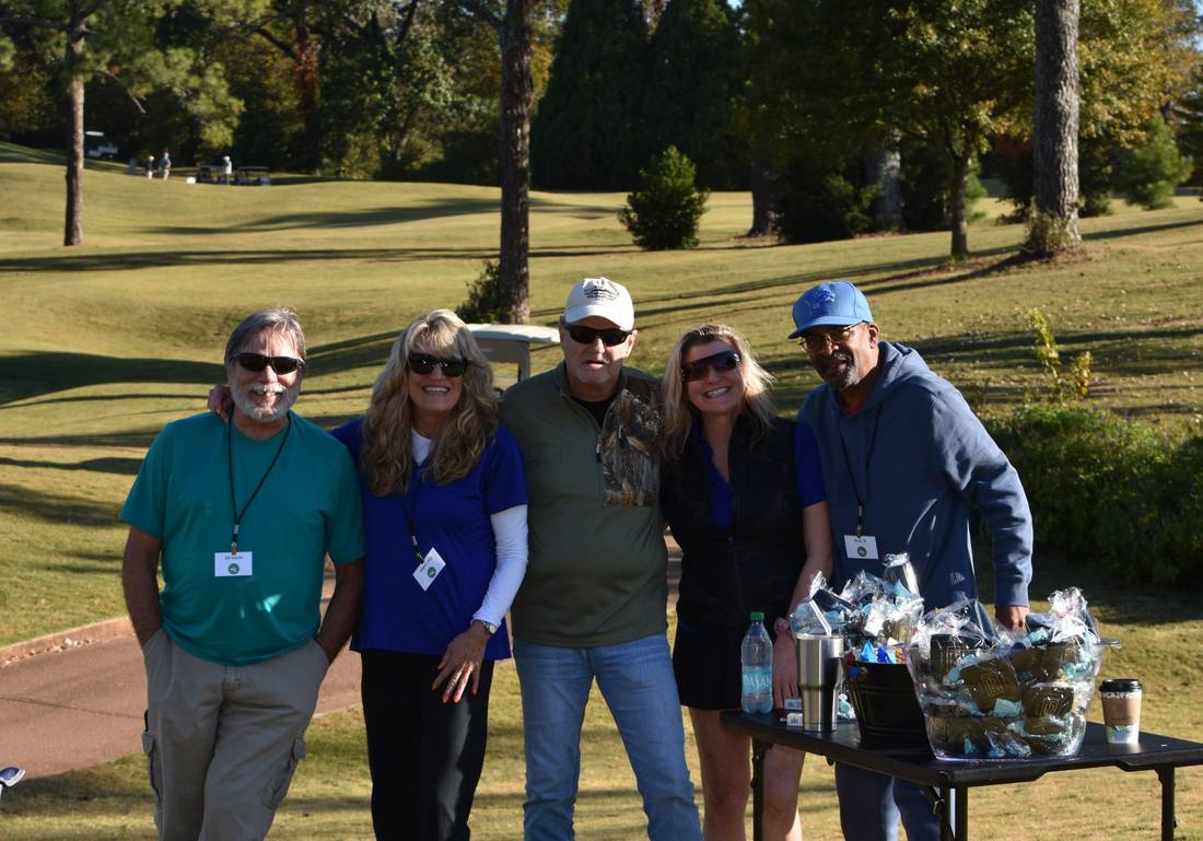 Golfers and volunteers gathered at the tournament