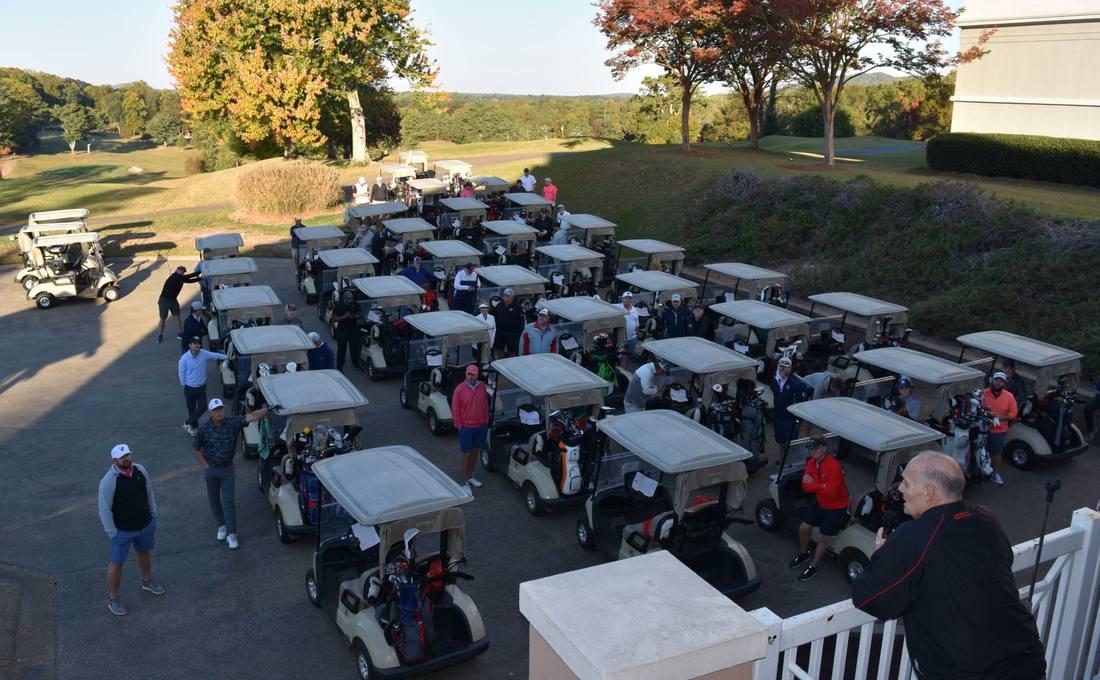 Rows of golf carts lined up before the shotgun start