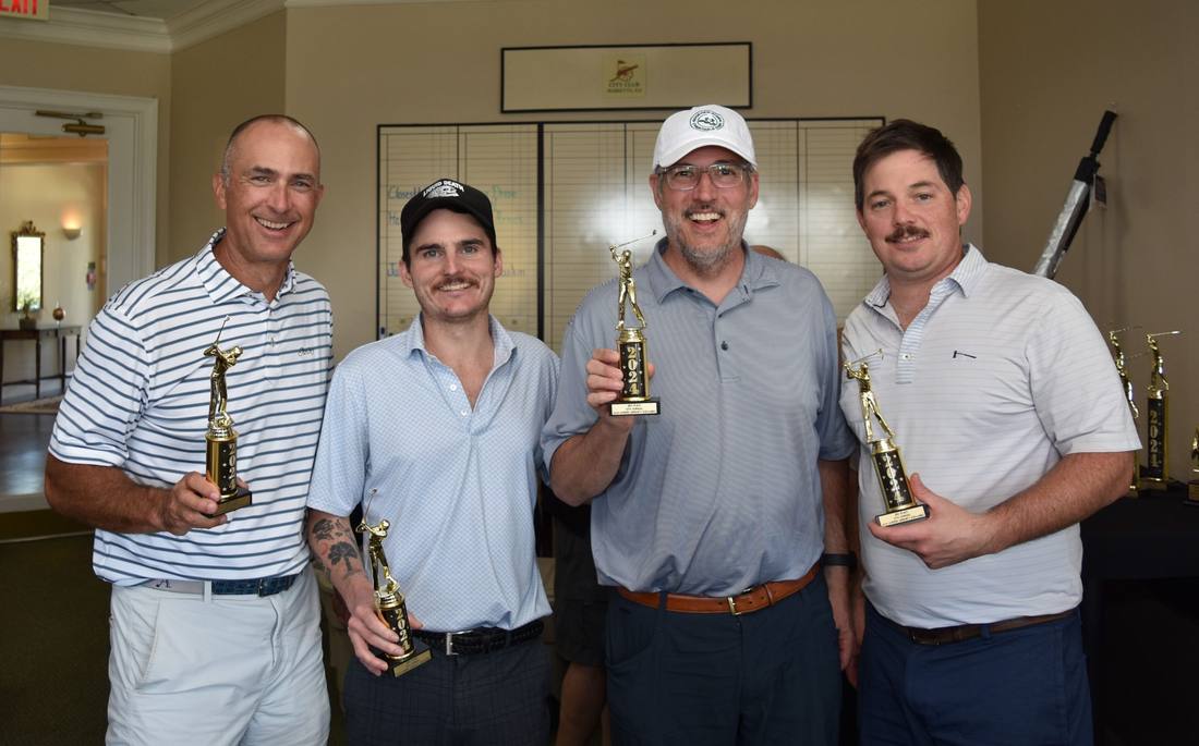Winning team holding their trophies