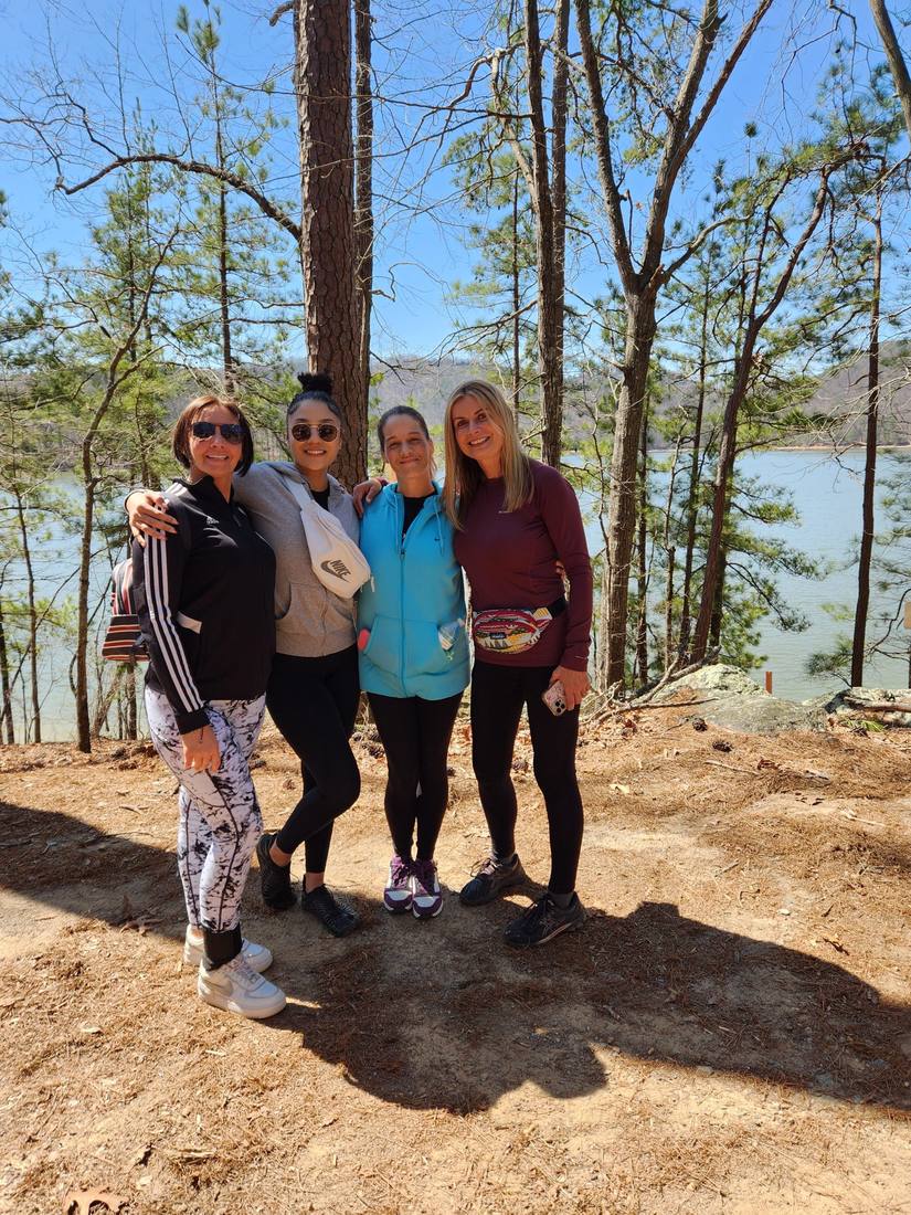 A group of walkers by the lake